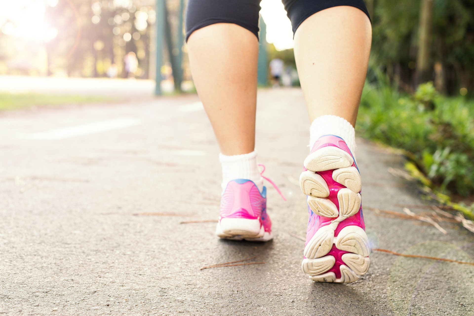 A photo of a woman's feet walking away from the camera